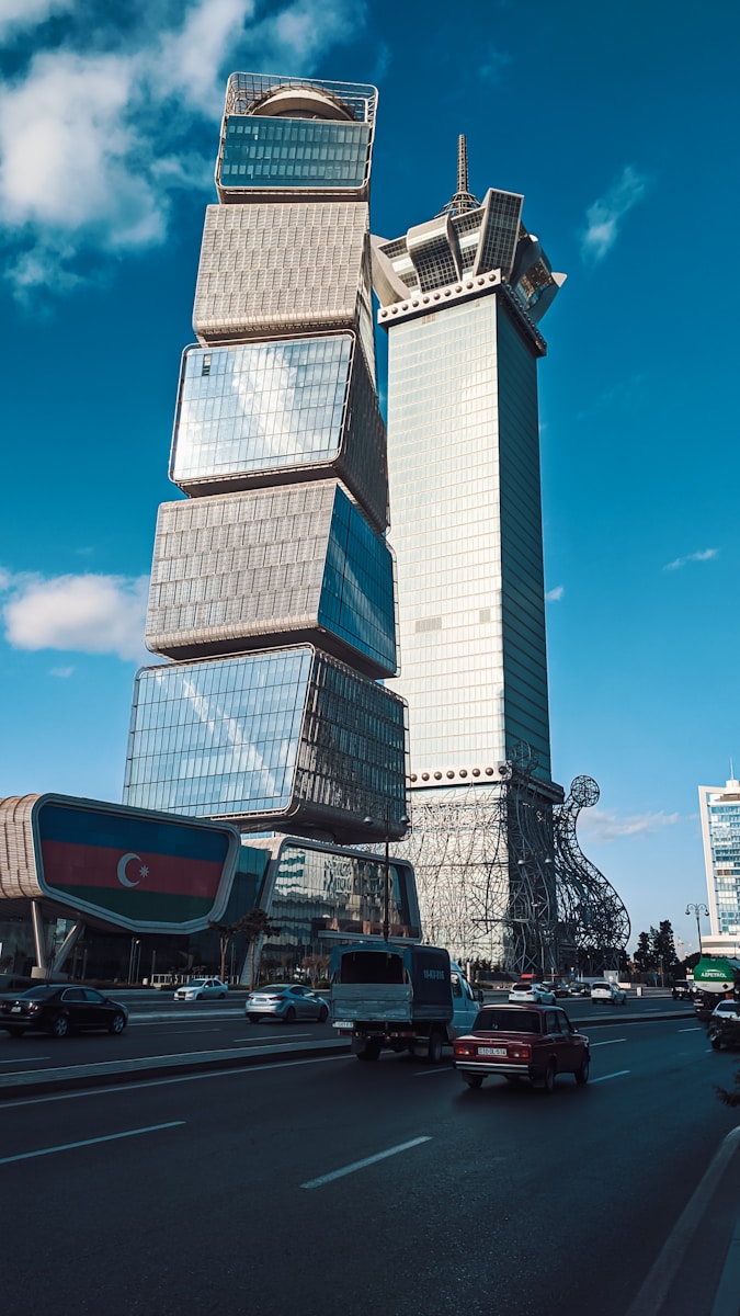 a very tall building sitting on the side of a road