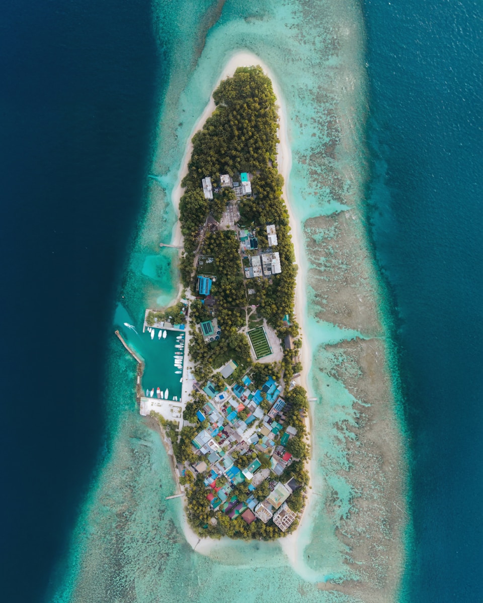 Aerial view of a tropical island surrounded by ocean.